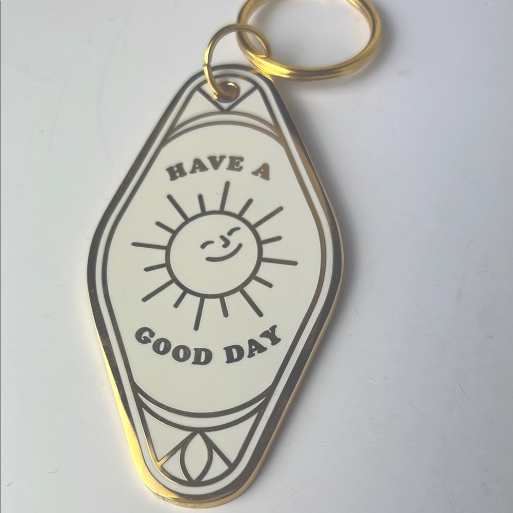 Gold and White Keychain with Have A Good Day Sun Design